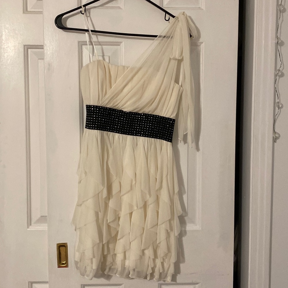 Cream with black waist band.  One shoulder mesh strap.
